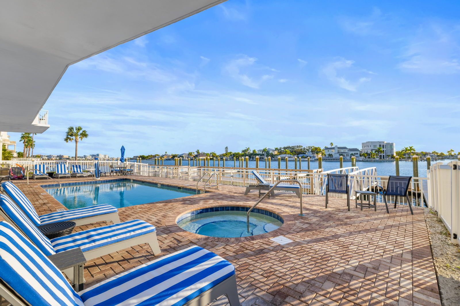image Relax by the pool and soak up the sun with a refreshing drink in hand. A perfect spot to unwind.