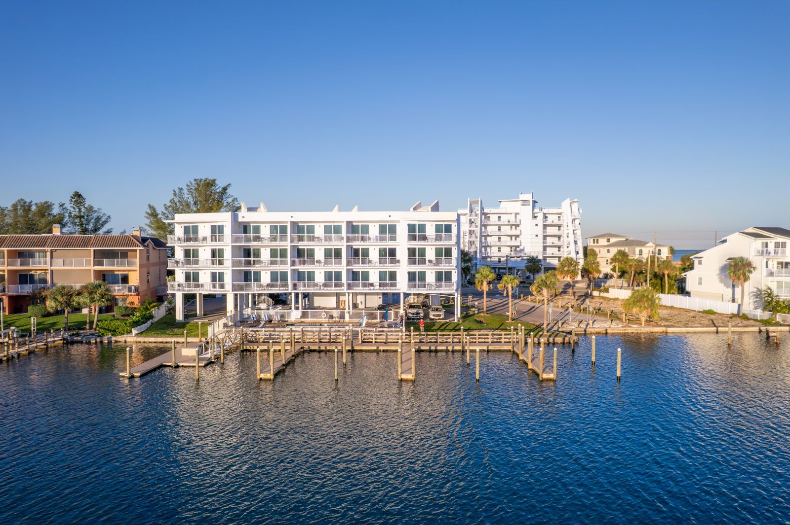 image Relax by the water, where boats gently bob against the sunlit docks, inviting you to explore.