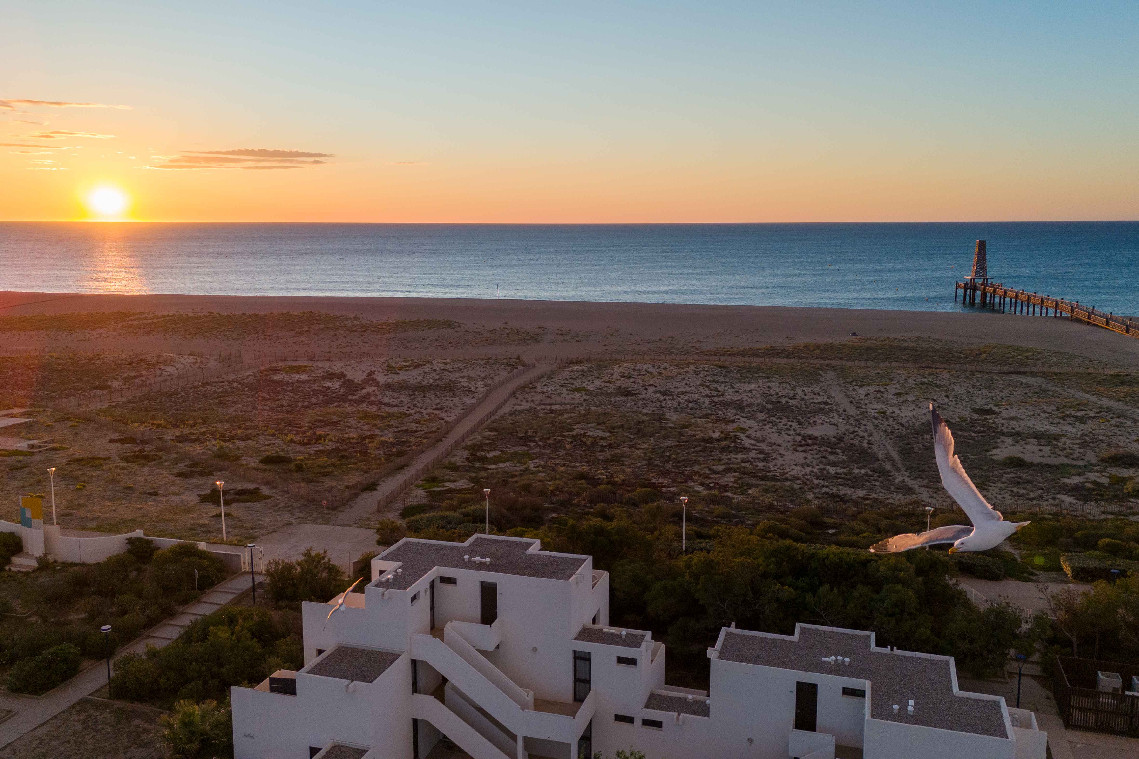 image Golden hour over the Leucate coastline — 16 km of fine sandy beach unfold right at the edge of the residence.