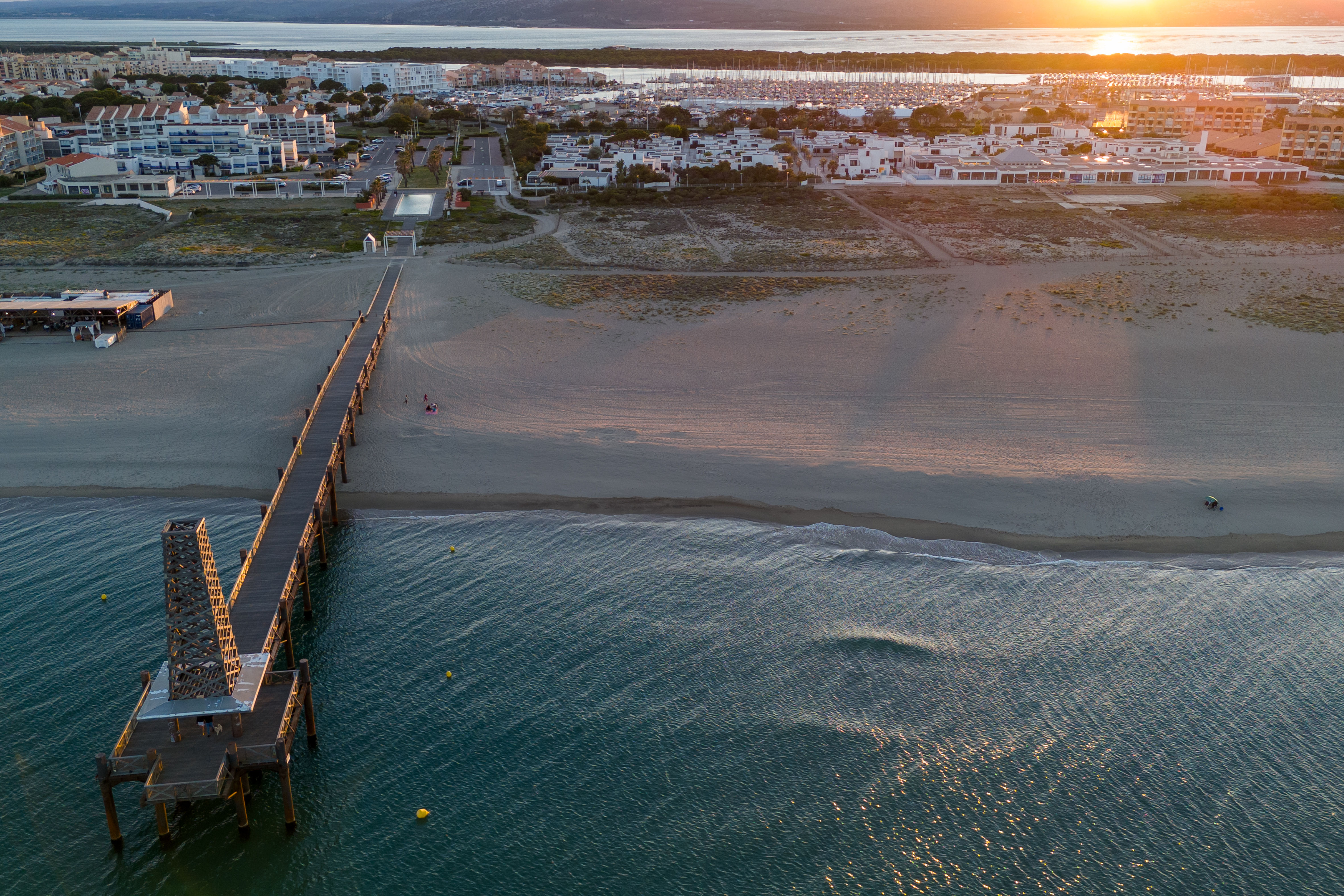 image Aerial view of Port Leucate marina at dusk — restaurants, shops and the port village just 1 km away.