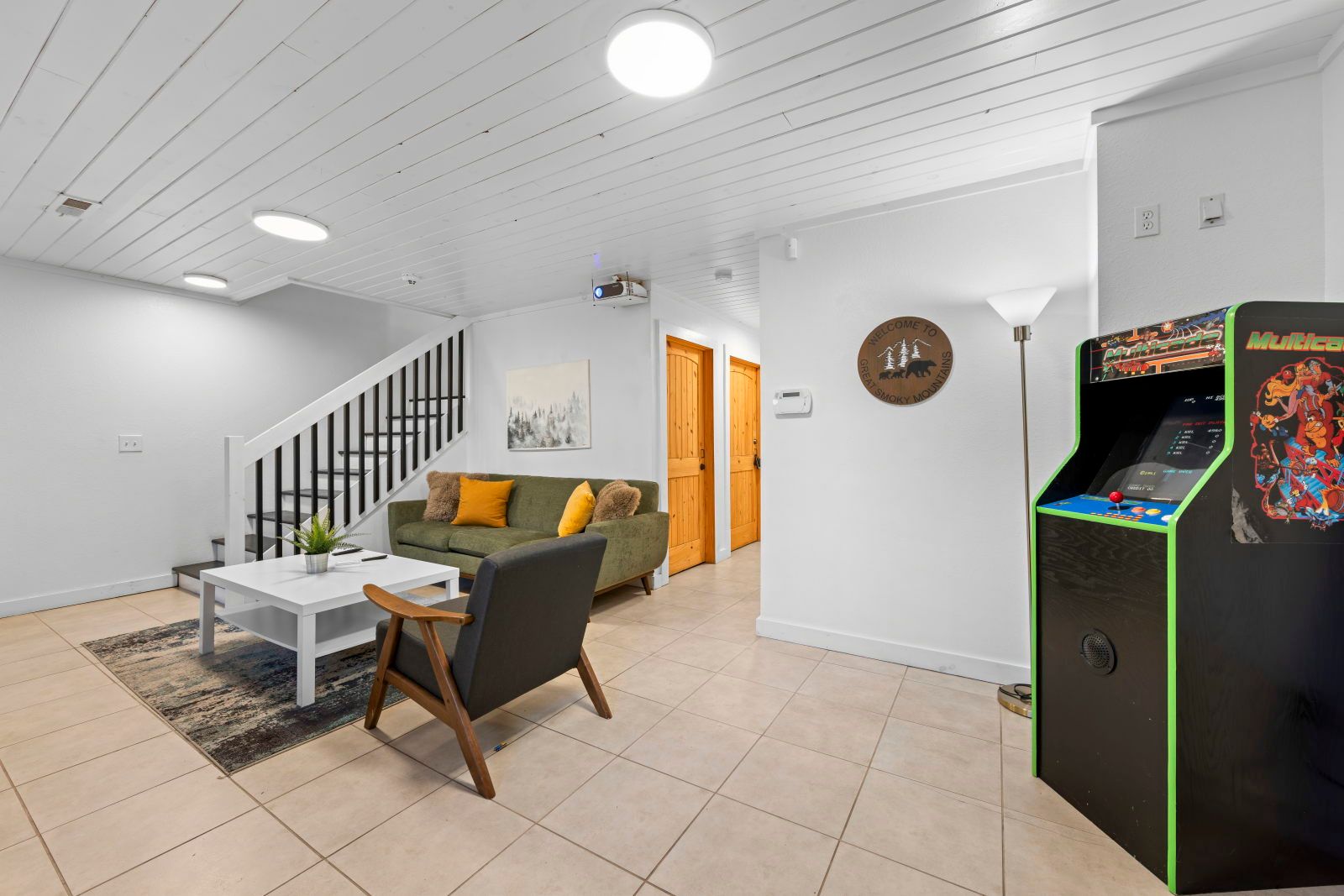 image Relax on the cozy sofa with plush cushions, perfect for unwinding after a day of adventure.