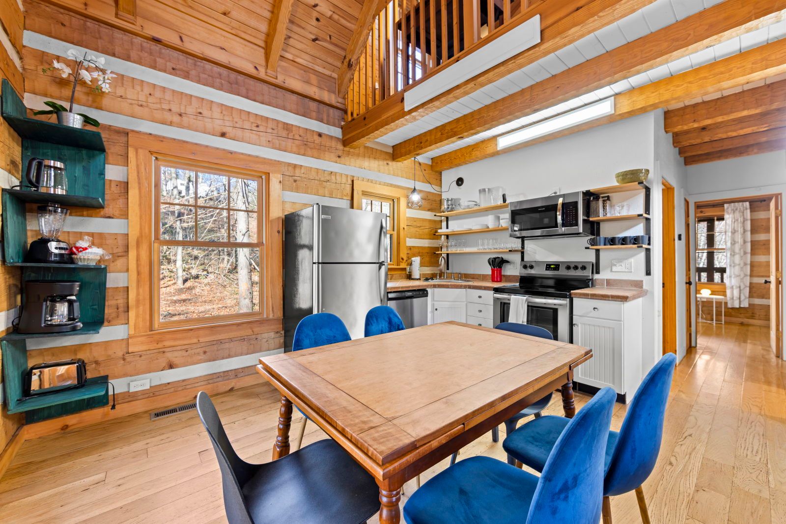 image Savor meals at the charming dining table, set against a backdrop of rustic wood and natural light.