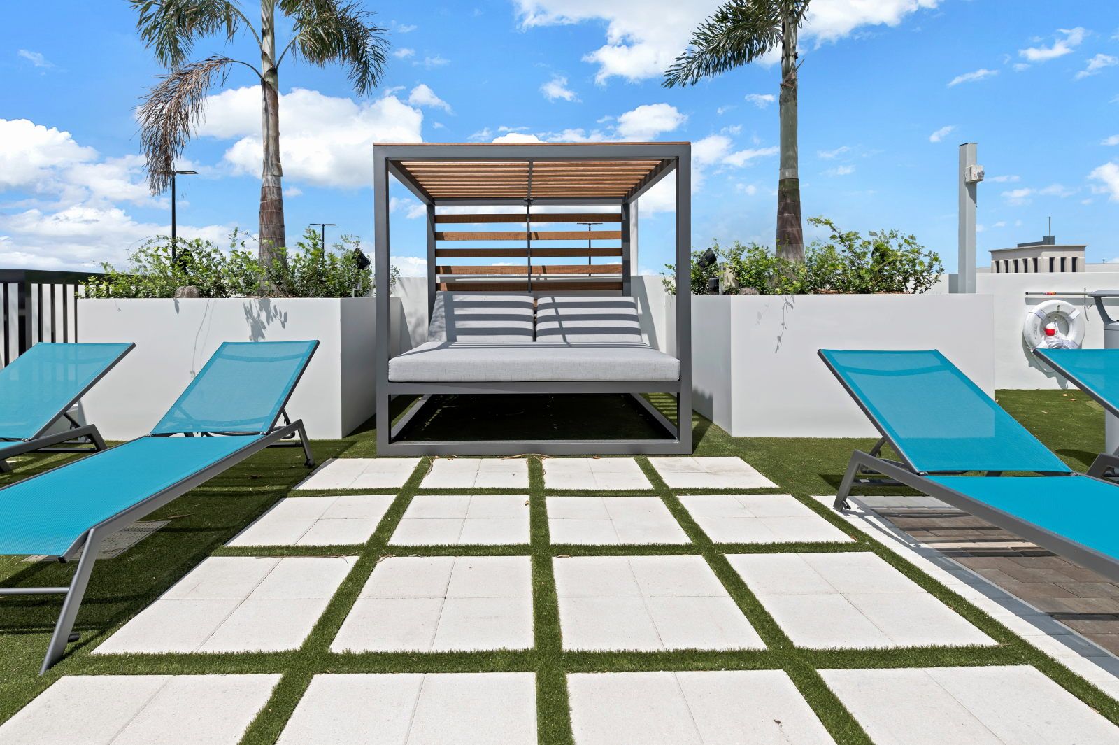 image Cozy up in this inviting cabana, surrounded by lush greenery and sunshine.
