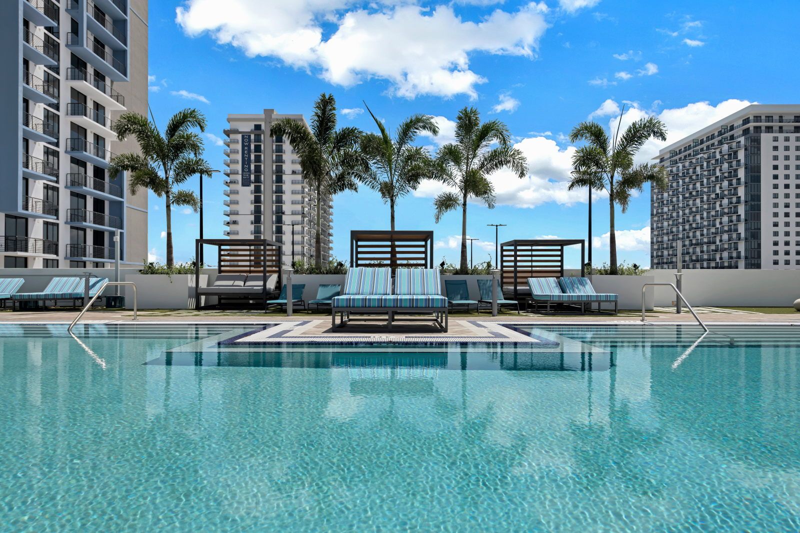 image Dive into relaxation at this resort-style pool, surrounded by swaying palms and luxurious loungers.
