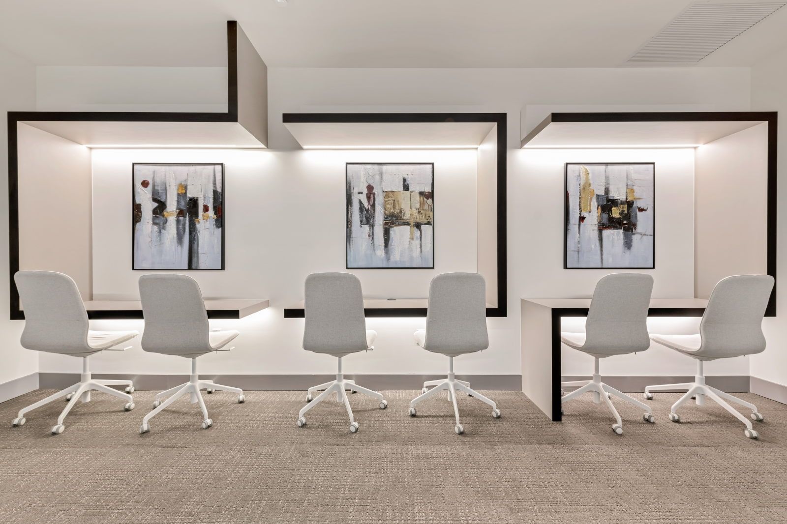 image Enjoy collaborative work in this inviting space, featuring sleek designs and vibrant artwork.
