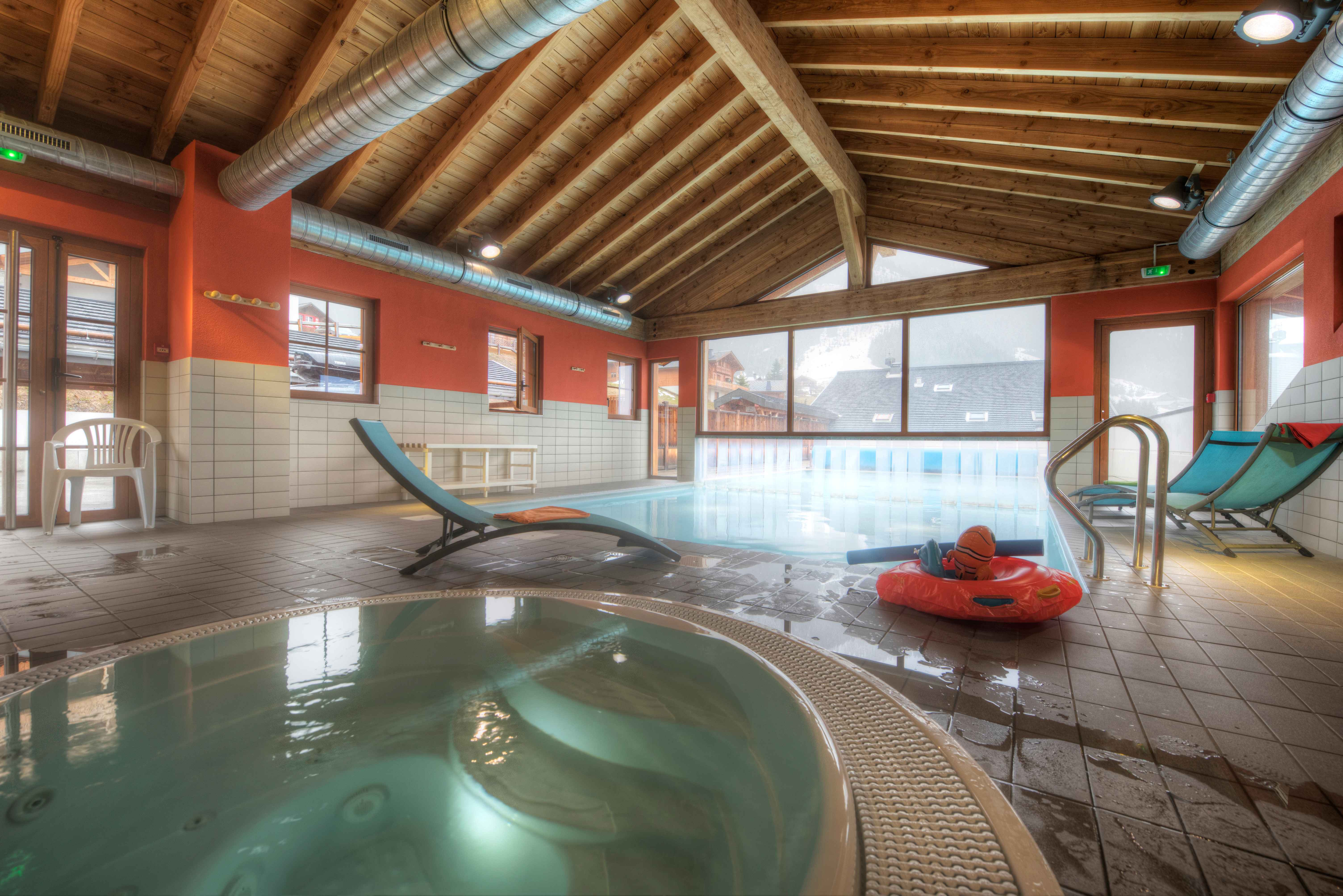 image Soothe your muscles in the on-site hot tub after a powder day in winter or a long day of hiking and biking in summer Châtel.