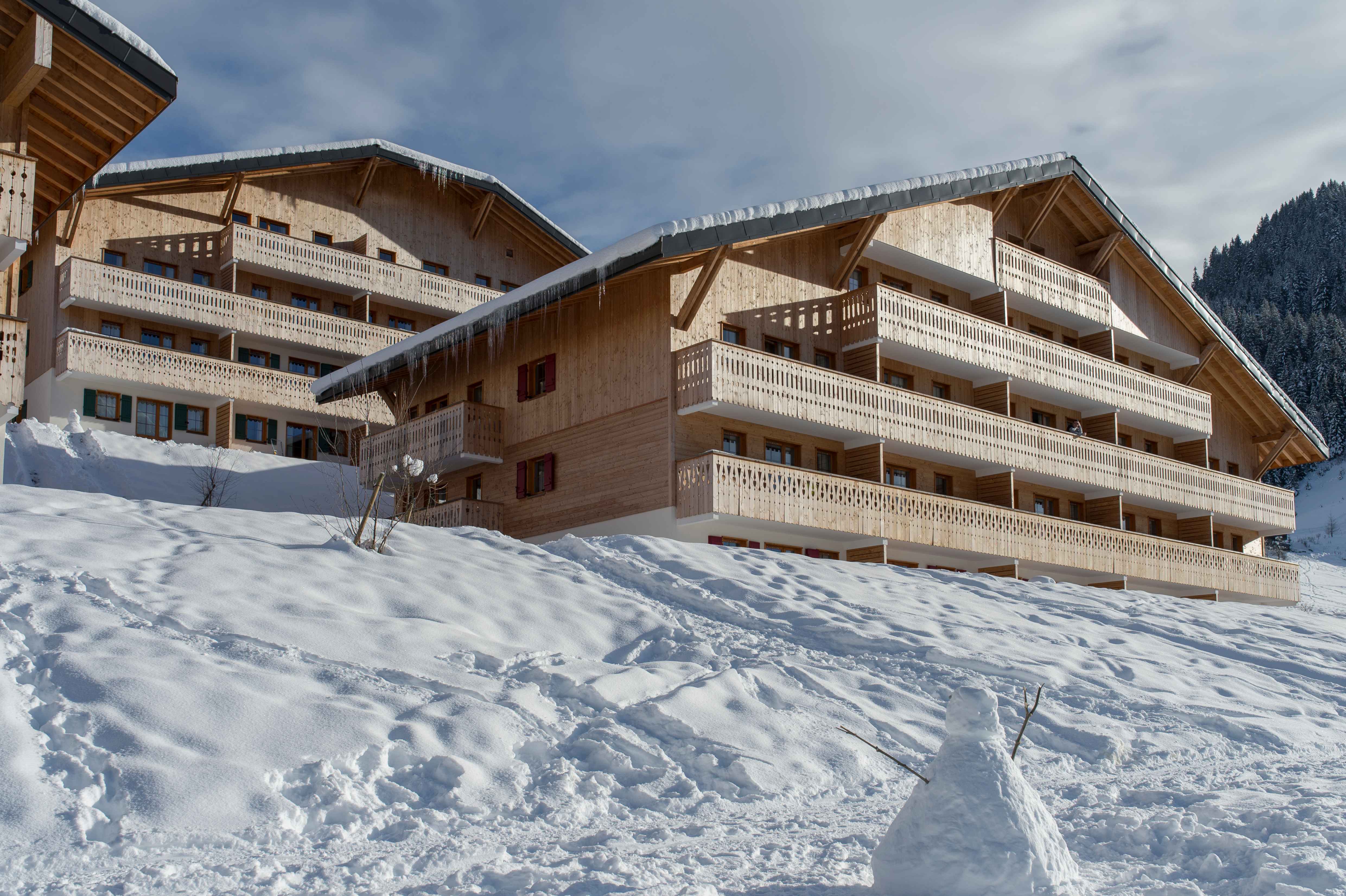 image Classic stone-and-wood alpine architecture at the heart of Châtel — a true mountain retreat in every season.