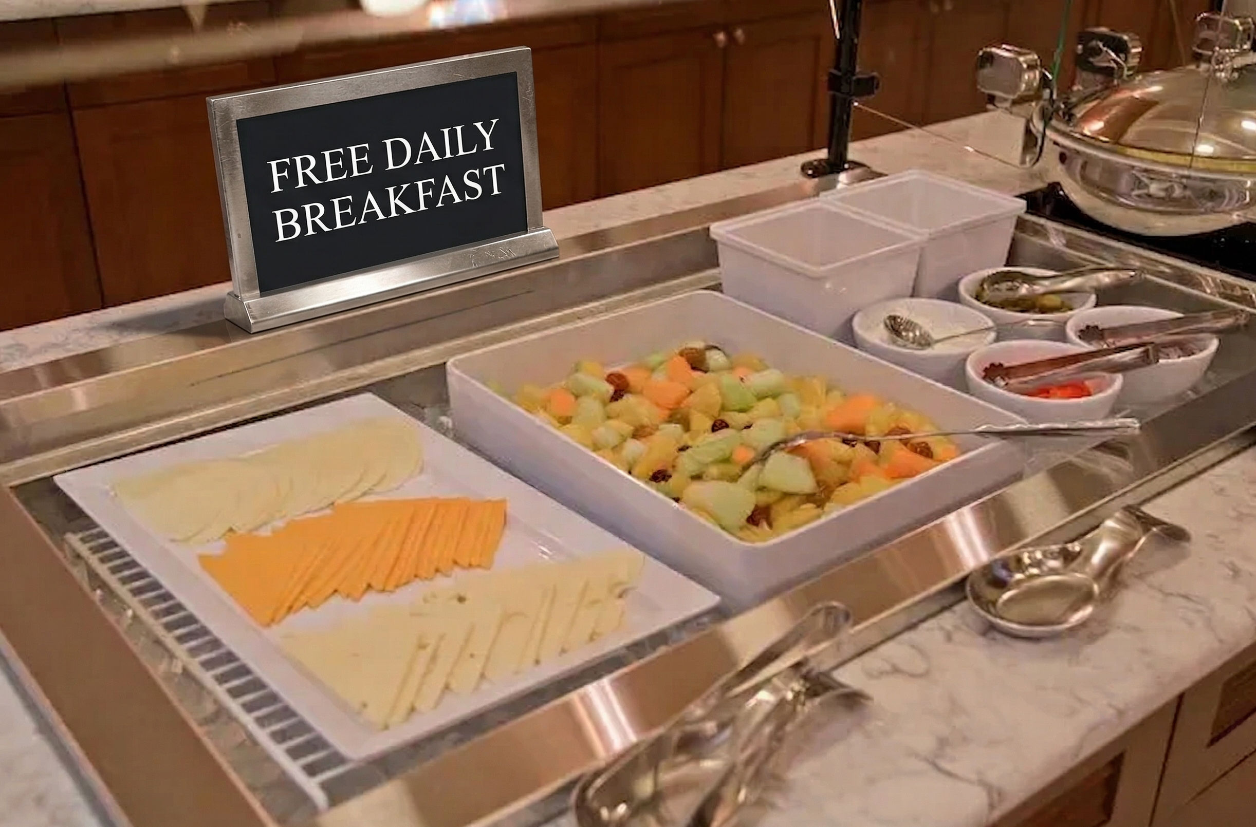 image Buffet selection of fruits and cheeses to start your day.