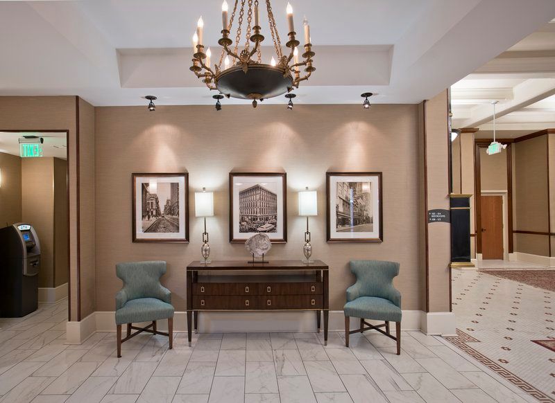 image Inviting lobby adorned with vintage art and soft lighting.