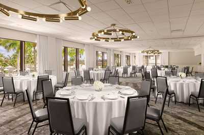 Reception-ready ballroom with cascading pendant lighting and a layout that works for seated dinners or receptions