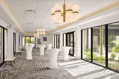 Airy event spaces with floor-to-ceiling windows and outdoor access for gatherings of all sizes