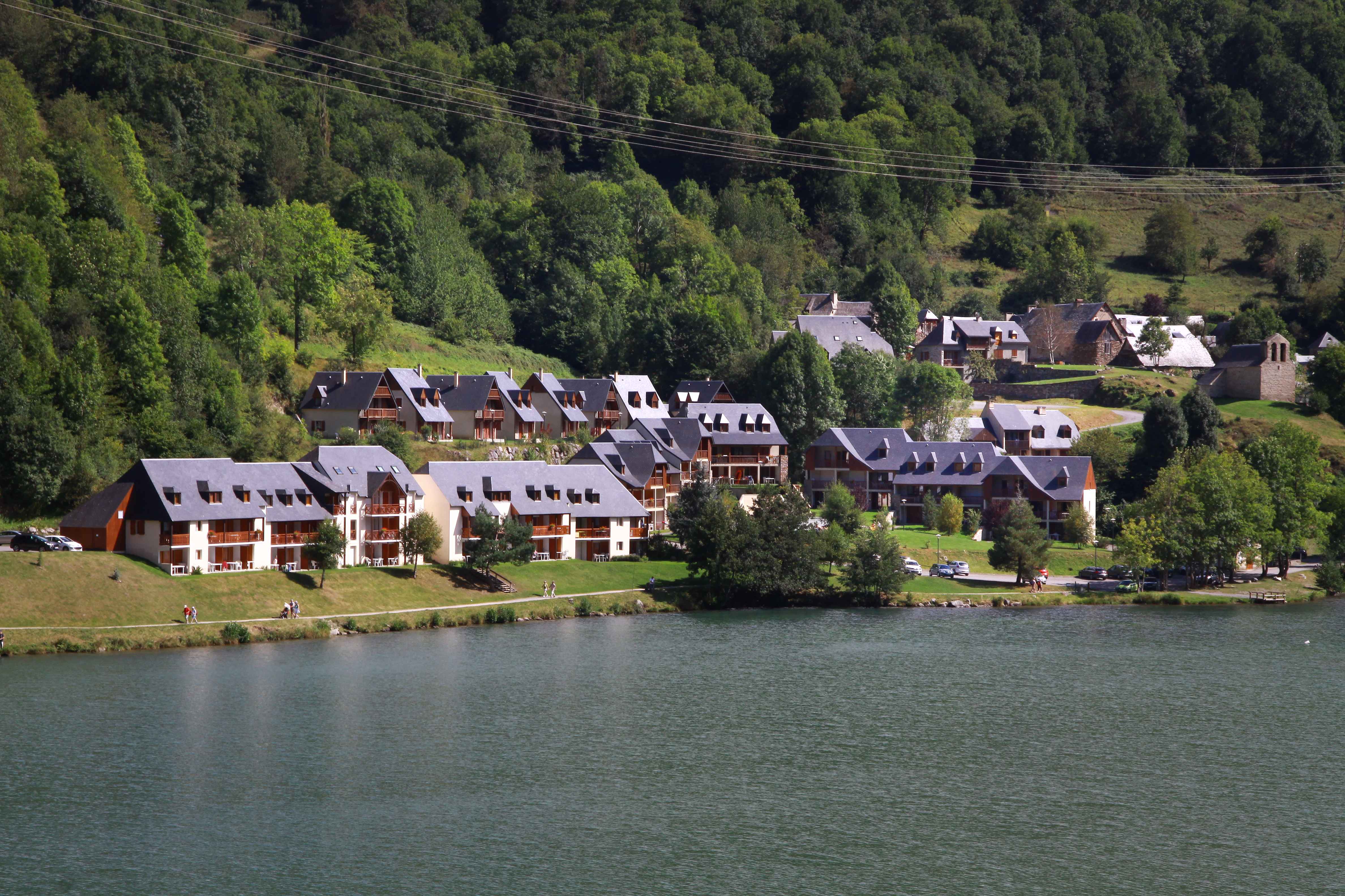 image Set on the peaceful shores of Lake Génos, this lakeside setting connects you directly to nature while staying close to village life.