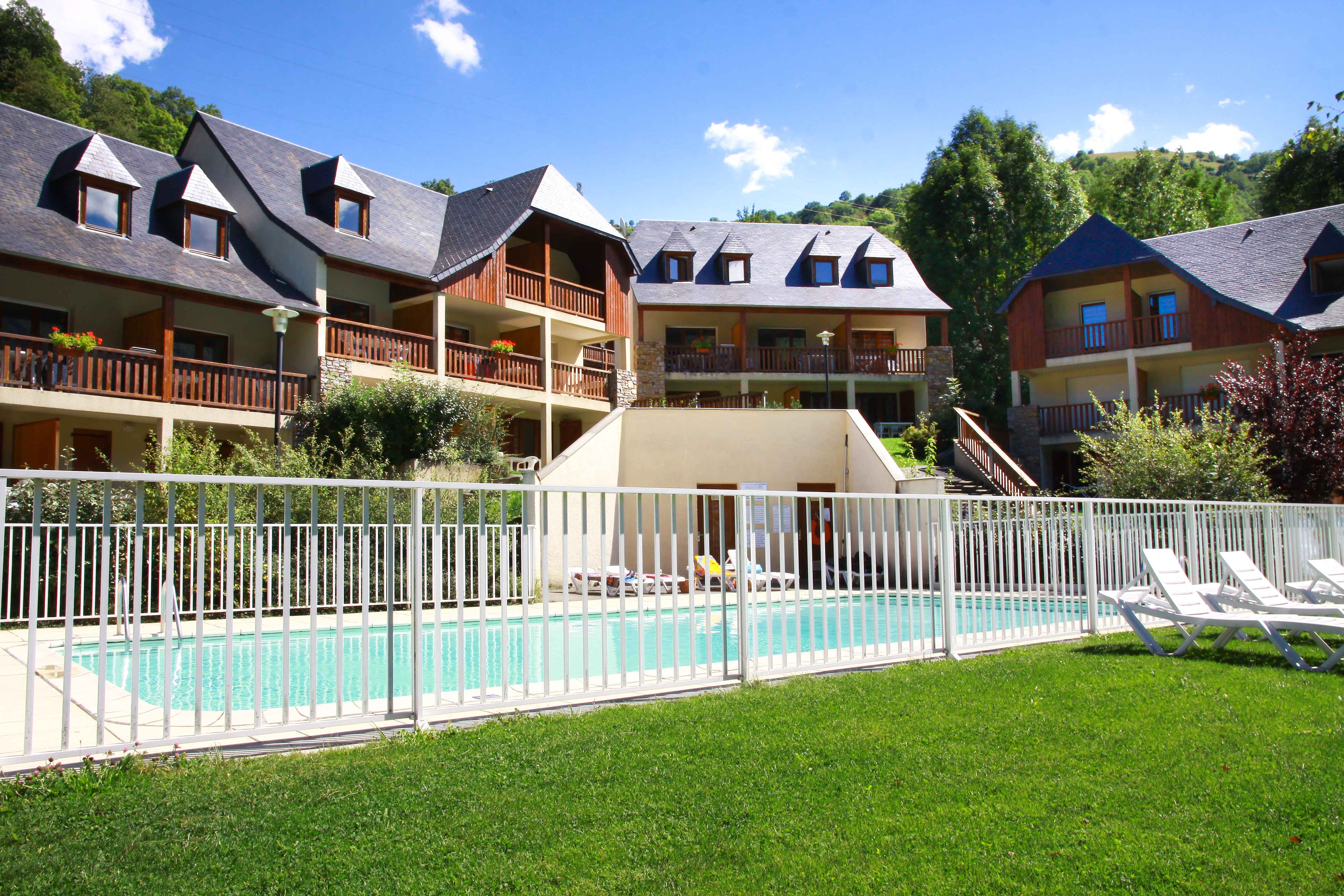 image With snow-dusted rooftops and towering Pyrenean peaks behind, the residence becomes a true winter retreat just minutes from the Val-Louron and Peyragudes ski areas.