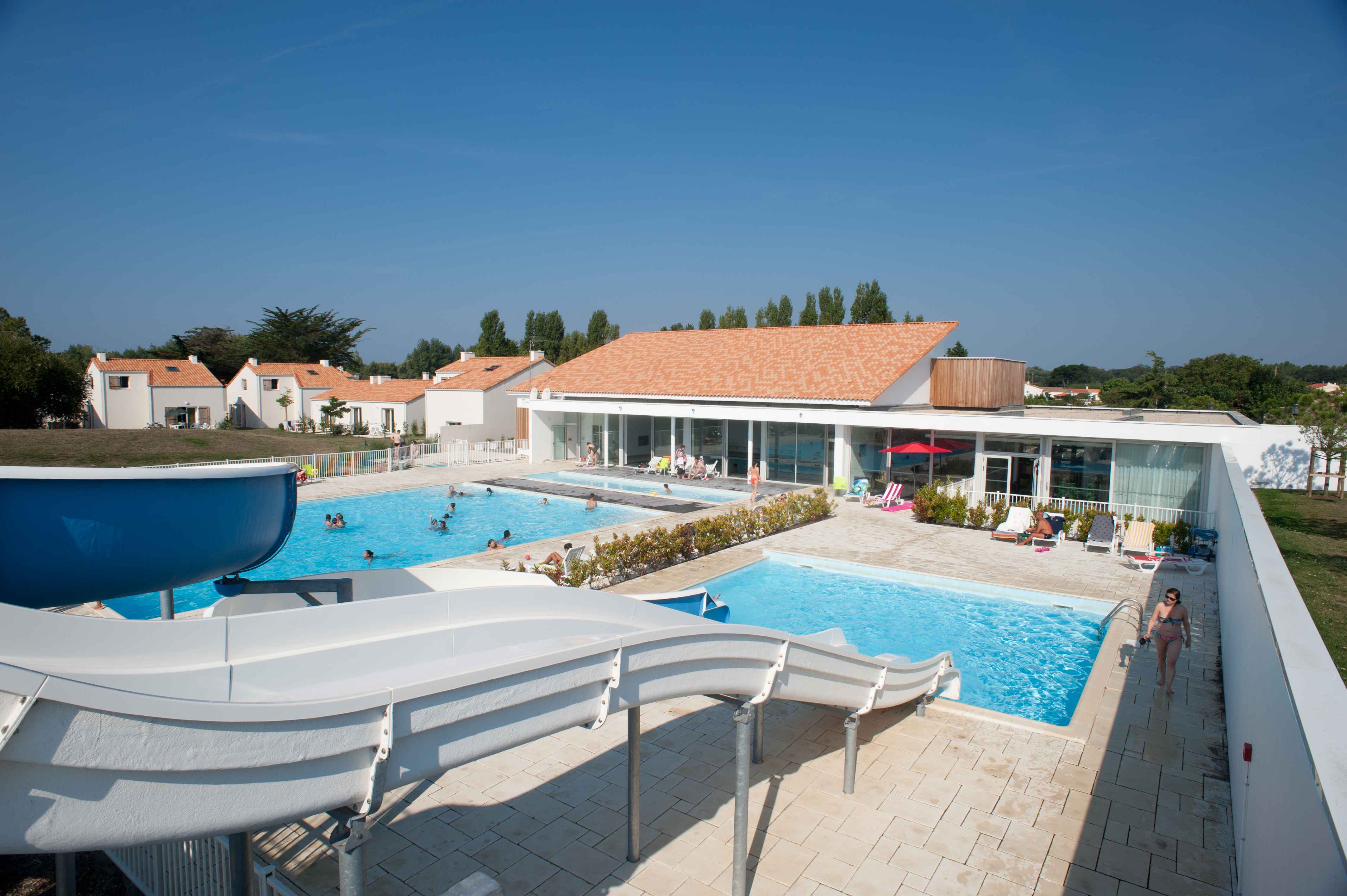 image Aerial view of the outdoor pool area with the residence buildings and the Vendée sky in the background.
