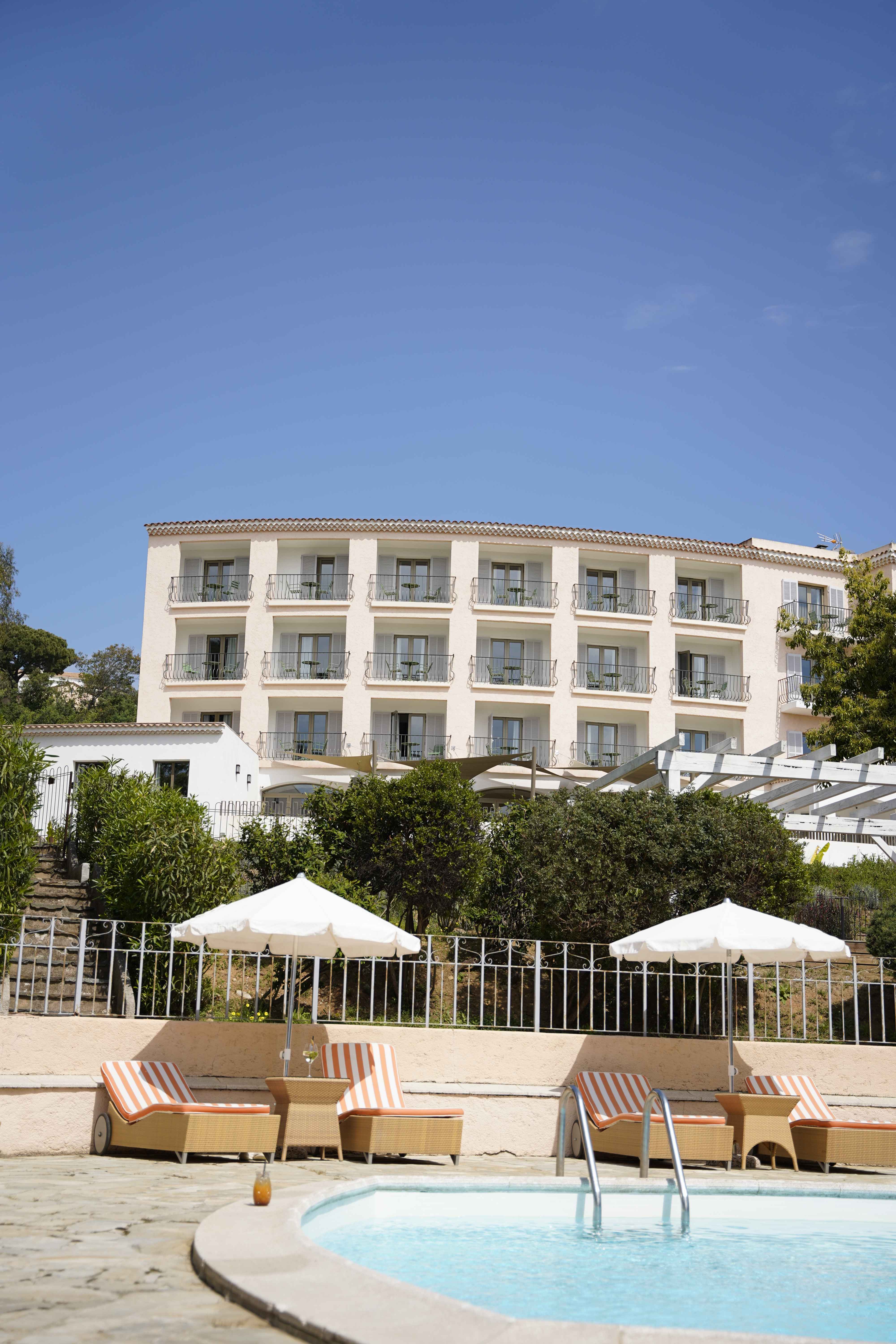 image The pink hotel façade frames the pool area — 36 rooms overlook the park and gardens