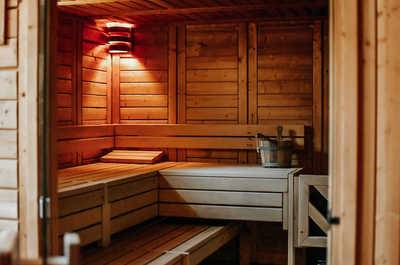 Sauna with wooden benches, free to use during your stay.