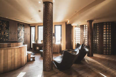 Natural wood and mosaic details in the spa — book a massage treatment after a day of climbing or hiking at altitude.