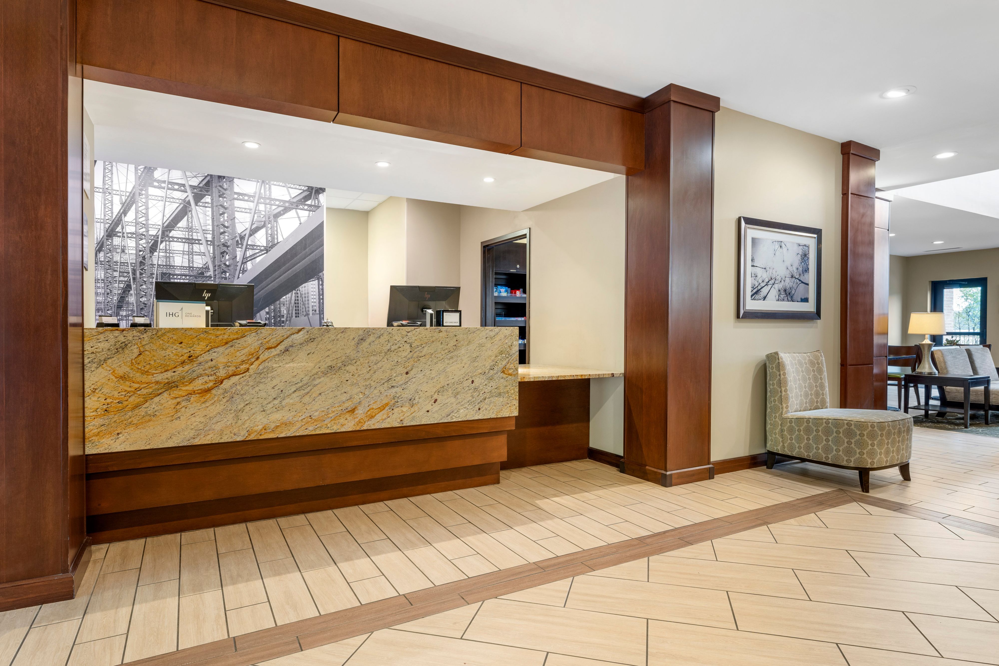 image Bright reception area featuring stone countertop and comfortable seating.