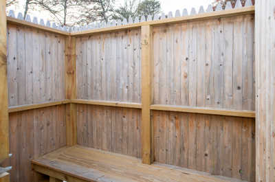 Take a refreshing outdoor shower, surrounded by natural wood for a relaxing feel.