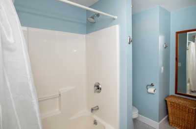 Refresh with ease in a clean, bright shower space featuring modern fixtures and a soothing atmosphere.
