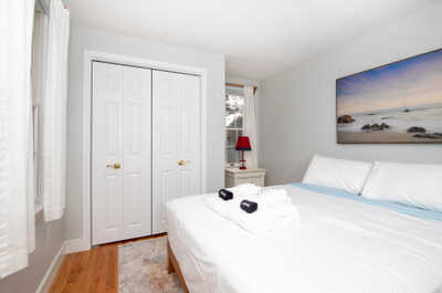 Unwind in a cozy space adorned with calming hues and a touch of coastal charm, complete with fresh towels just for you.