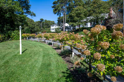 Enjoy landscaped surroundings that enhance your coastal escape, with well-kept flowers lining tranquil paths.