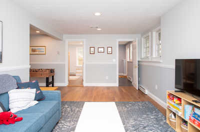 A warm and inviting living space with natural light shining through bright windows.
