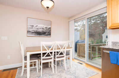 Gather around the dining table, where meals and memories come to life in a bright atmosphere.