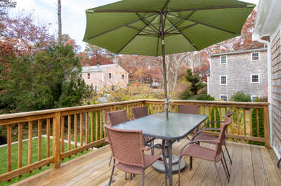 Gather around the spacious outdoor table, ideal for meals or evening chats in a relaxed setting.