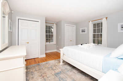Unwind in a cozy bedroom adorned with soft textiles and natural light, inviting relaxation after a day of adventure.