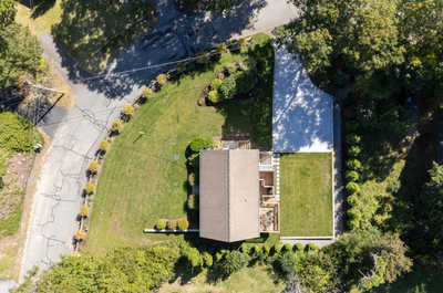 Get a bird's eye view of your peaceful retreat, nestled amid beautiful landscaping and quiet roads.