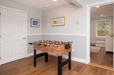 Your entertainment hub is ready with a foosball table and charming décor.