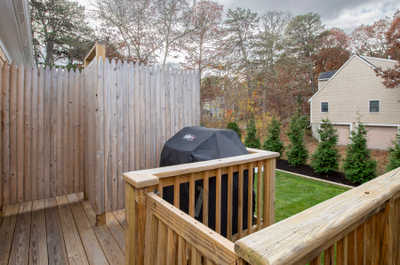 Enjoy easy access to outdoor grilling from your deck, blending nature and comfort.