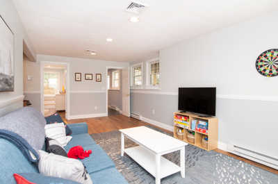 Gather around the cozy couch, perfect for game nights or movie marathons.