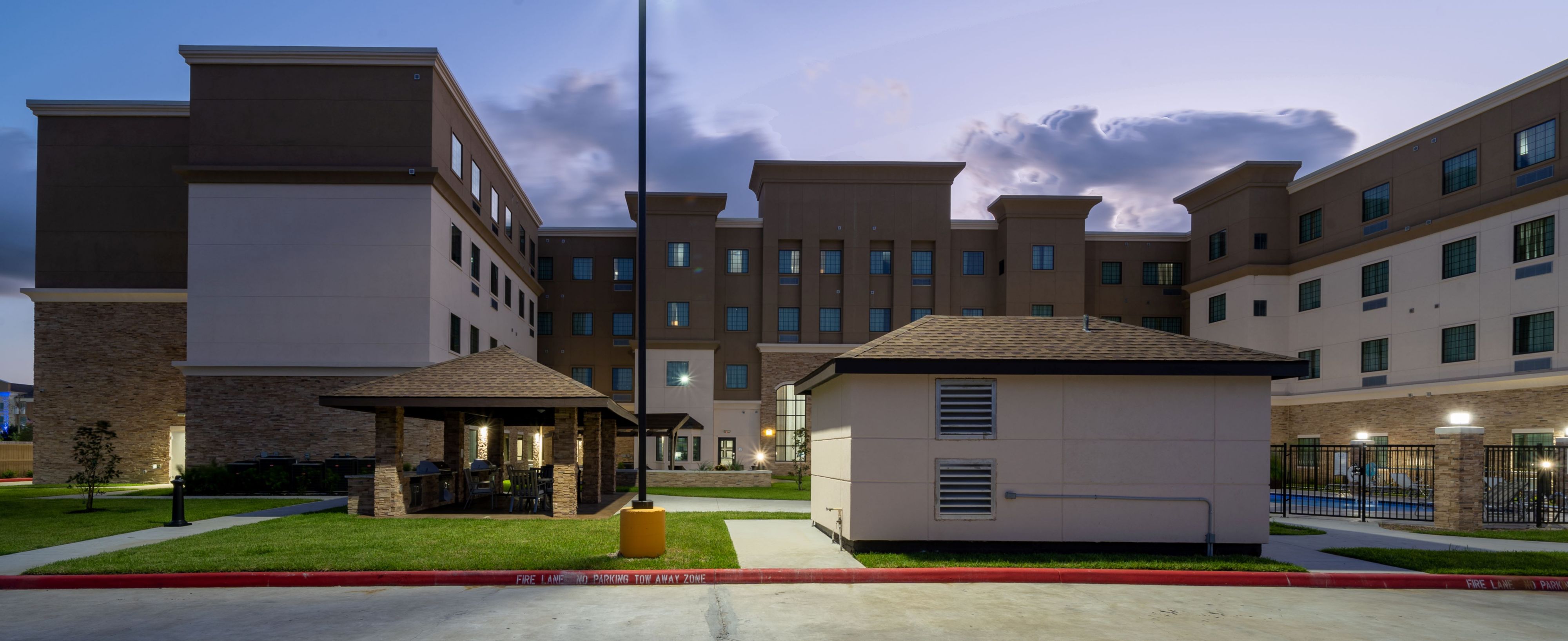 image Gather with friends in the outdoor covered seating area, perfect for evening chats.