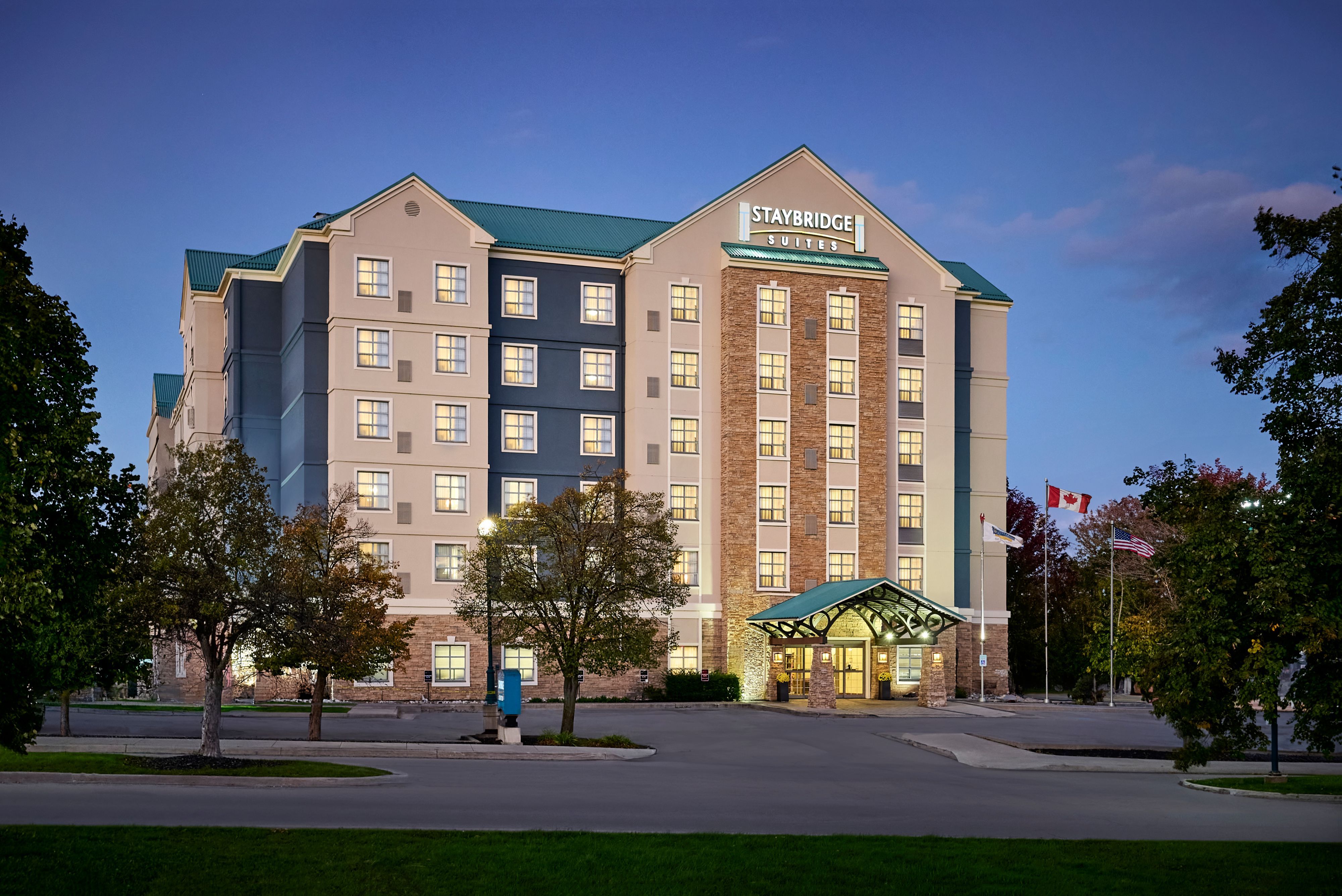 image Property exterior illuminated at dusk with evening lighting.