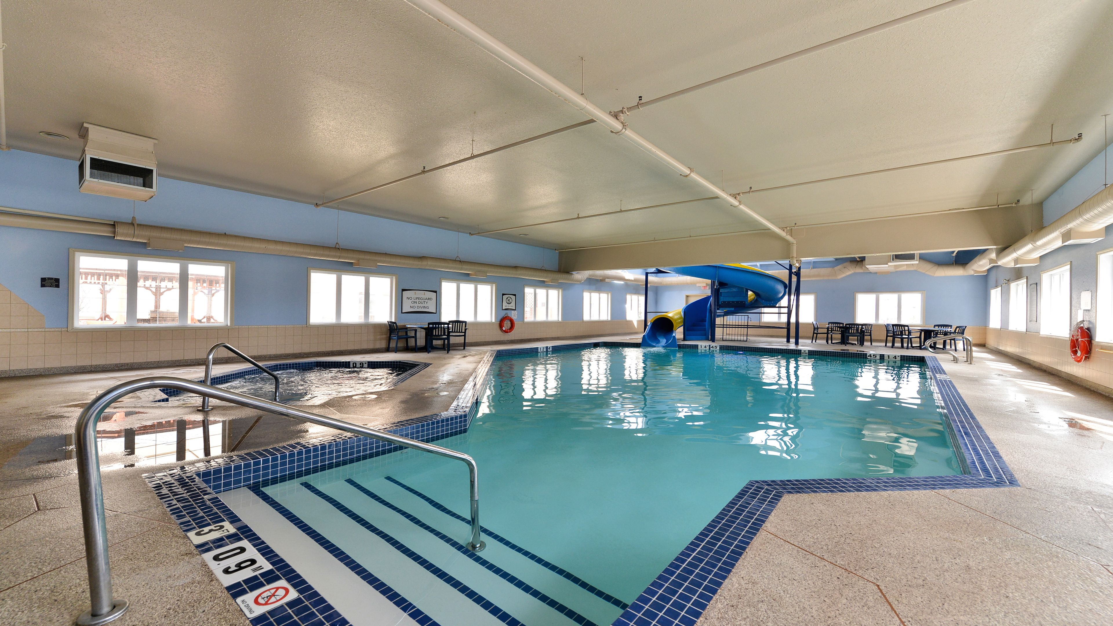 image Heated indoor pool with waterslide — family adventure waiting year-round.