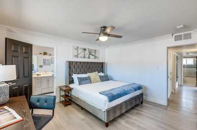 Enjoy a peaceful night’s sleep in this inviting bedroom featuring soft linens and modern touches.