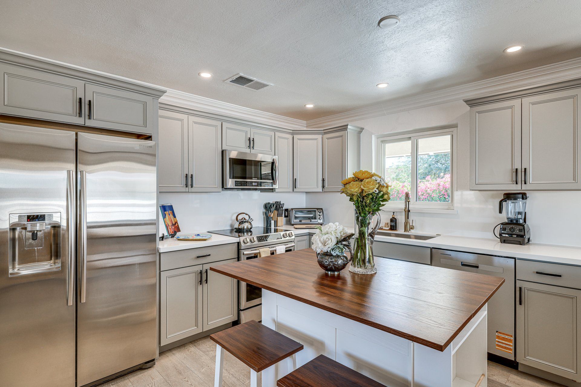 image Bright and functional kitchen awaits, perfect for whipping up meals with modern appliances and a cozy dining nook.