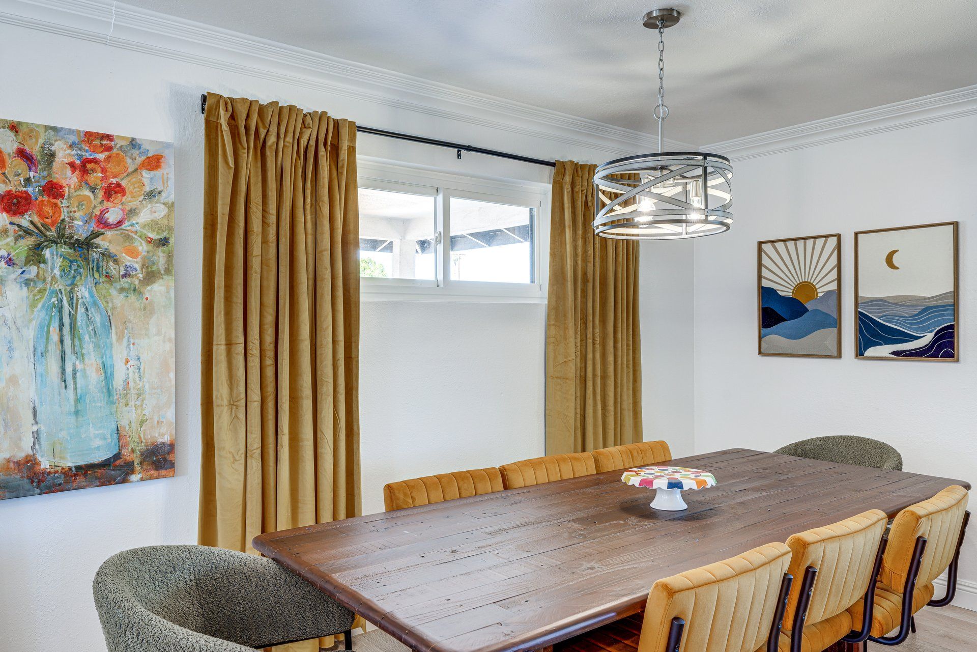 image Gather around the elegant dining table, accented by art and mood lighting, for memorable meals together.
