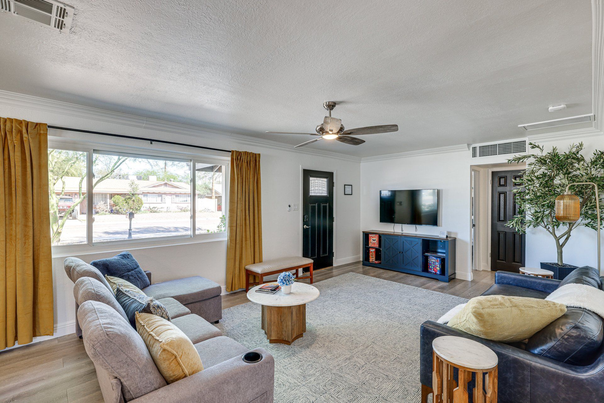 image Unwind in a spacious living area, where you can catch up on your favorite shows or simply enjoy the view.