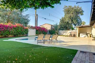 Lounge by your private pool, surrounded by vibrant bougainvillea and desert greenery.