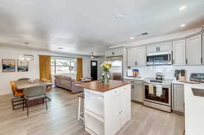 Gather around the spacious kitchen island, perfect for a quick breakfast or evening cocktails.