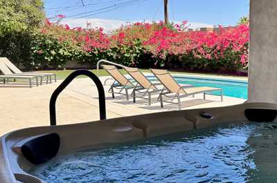 Relax in the hot tub, surrounded by the calming walls that invite you to unwind.