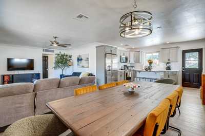 Gather around the large dining table for shared meals and cherished memories in the heart of your vacation.