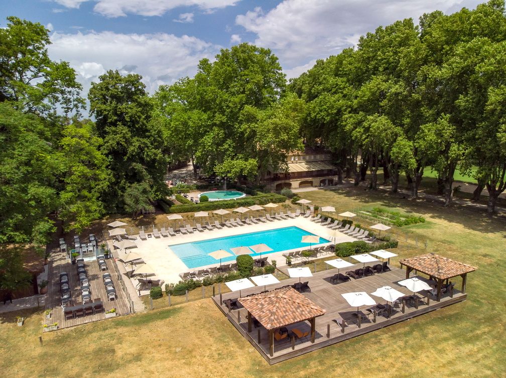 image The outdoor pool sits at the centre of a 7-hectare landscaped park, where sun loungers and shaded terraces invite guests to unwind between explorations of the Luberon.