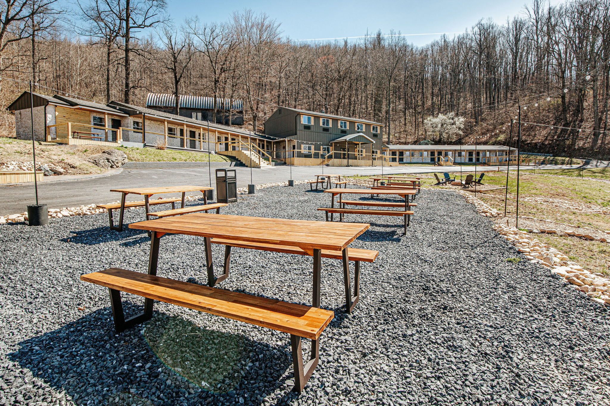 image Gather around the picnic tables for casual meals and evening chats under warm strings of lights.