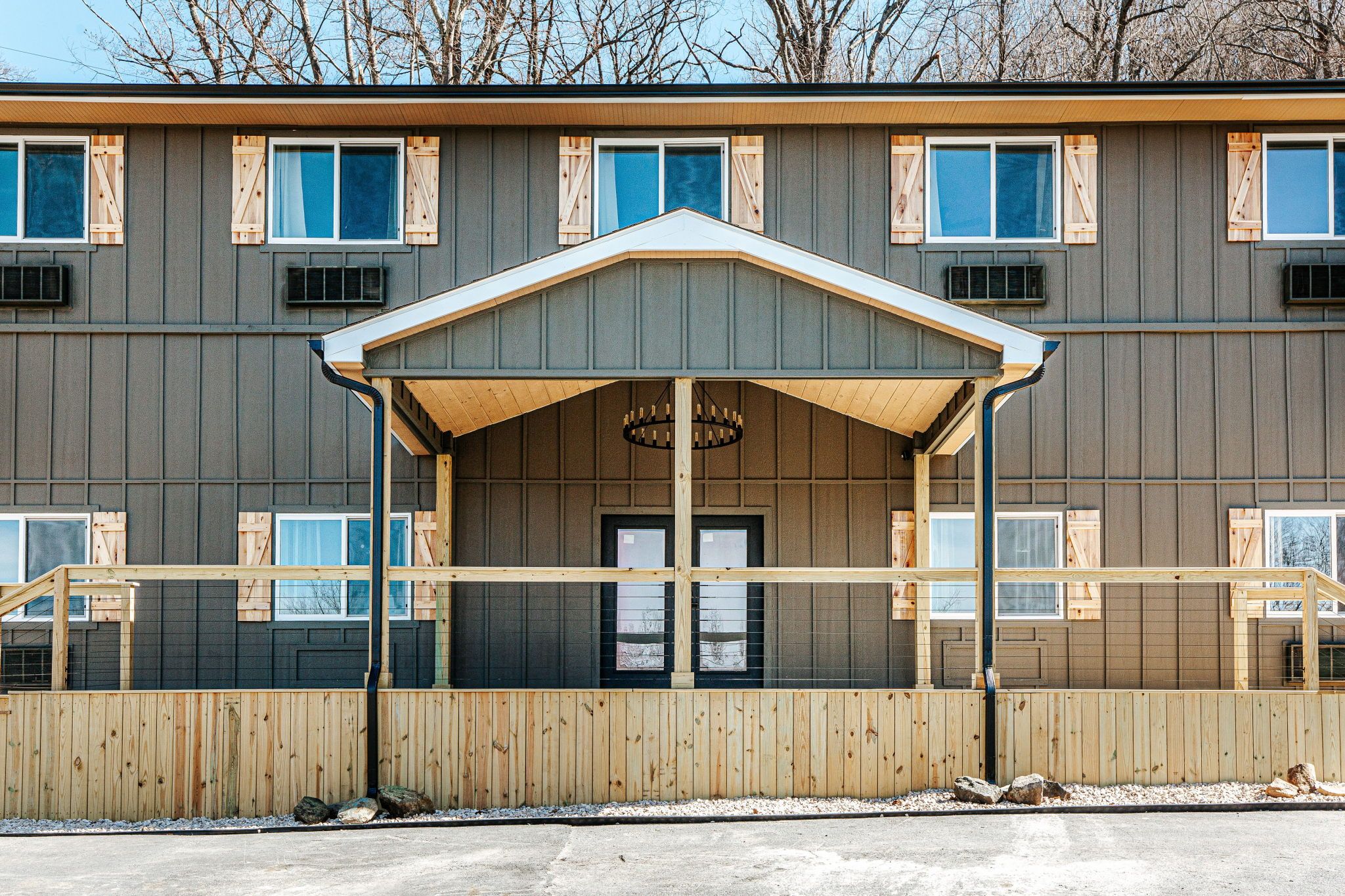 image Admire the charming facade, featuring wooden accents and ample natural light.