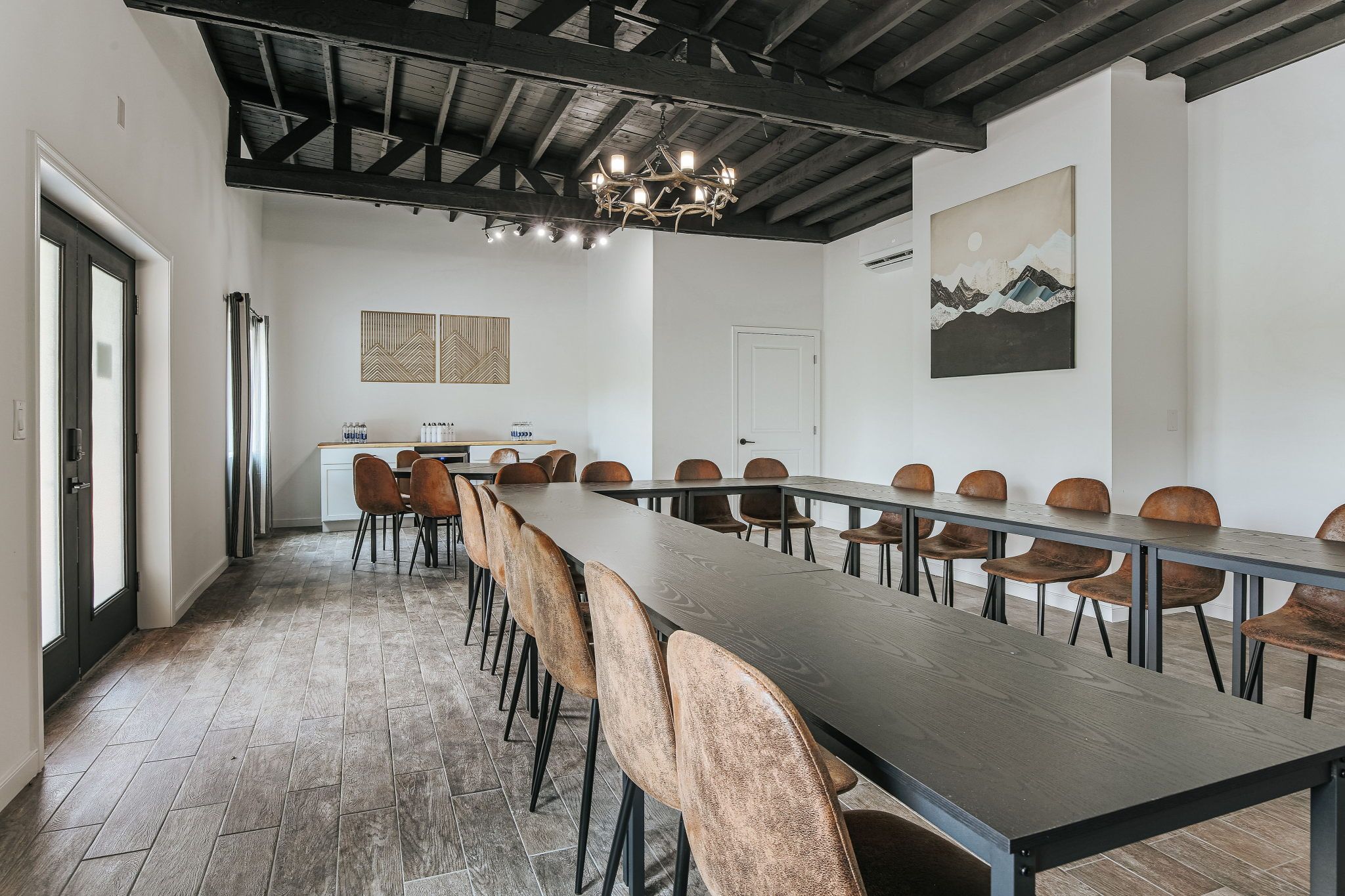 image Gather around the sleek table, surrounded by comfortable seating, perfect for creative discussions and brainstorming.