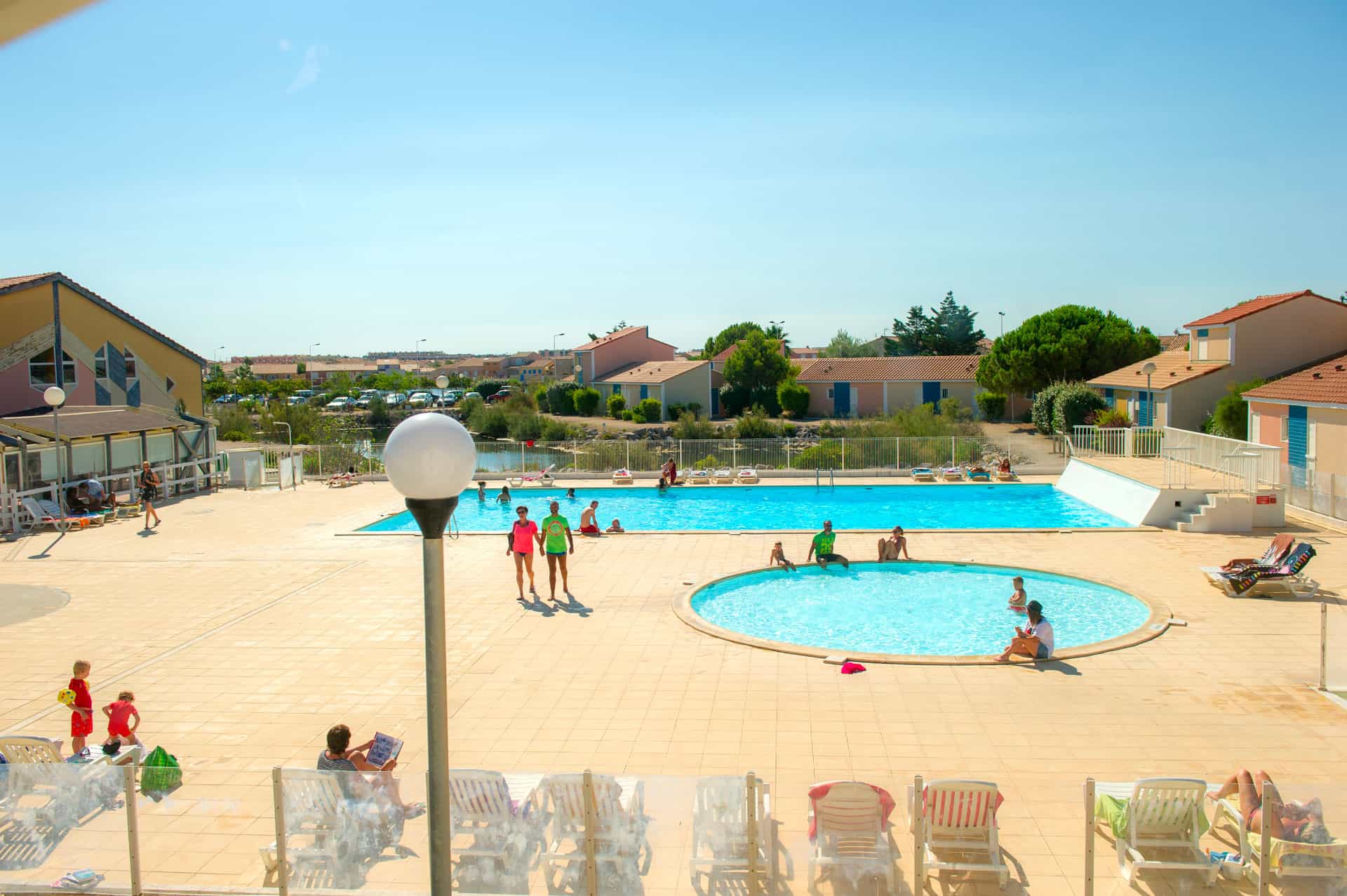 image The resort's main outdoor pool, one of two swimming areas on-site, perfect for long sunny afternoons on the Occitanie coast.